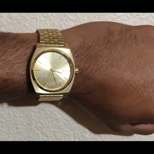 Men’s gold Nixon Time Teller watch